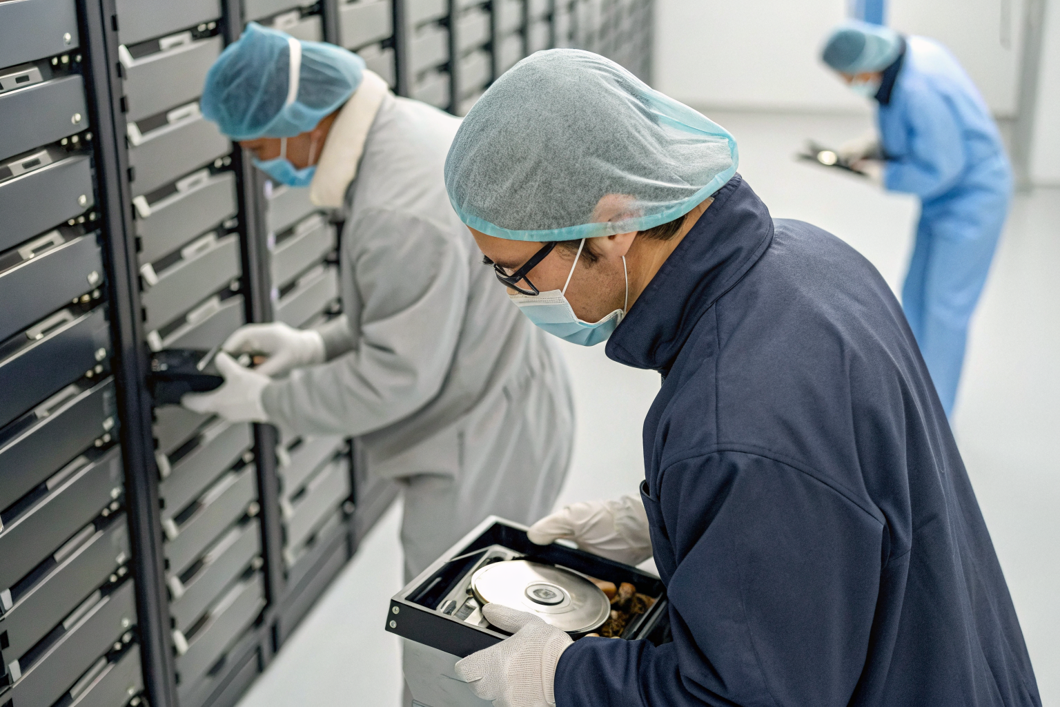 Technicians documenting chain of custody for data handling.