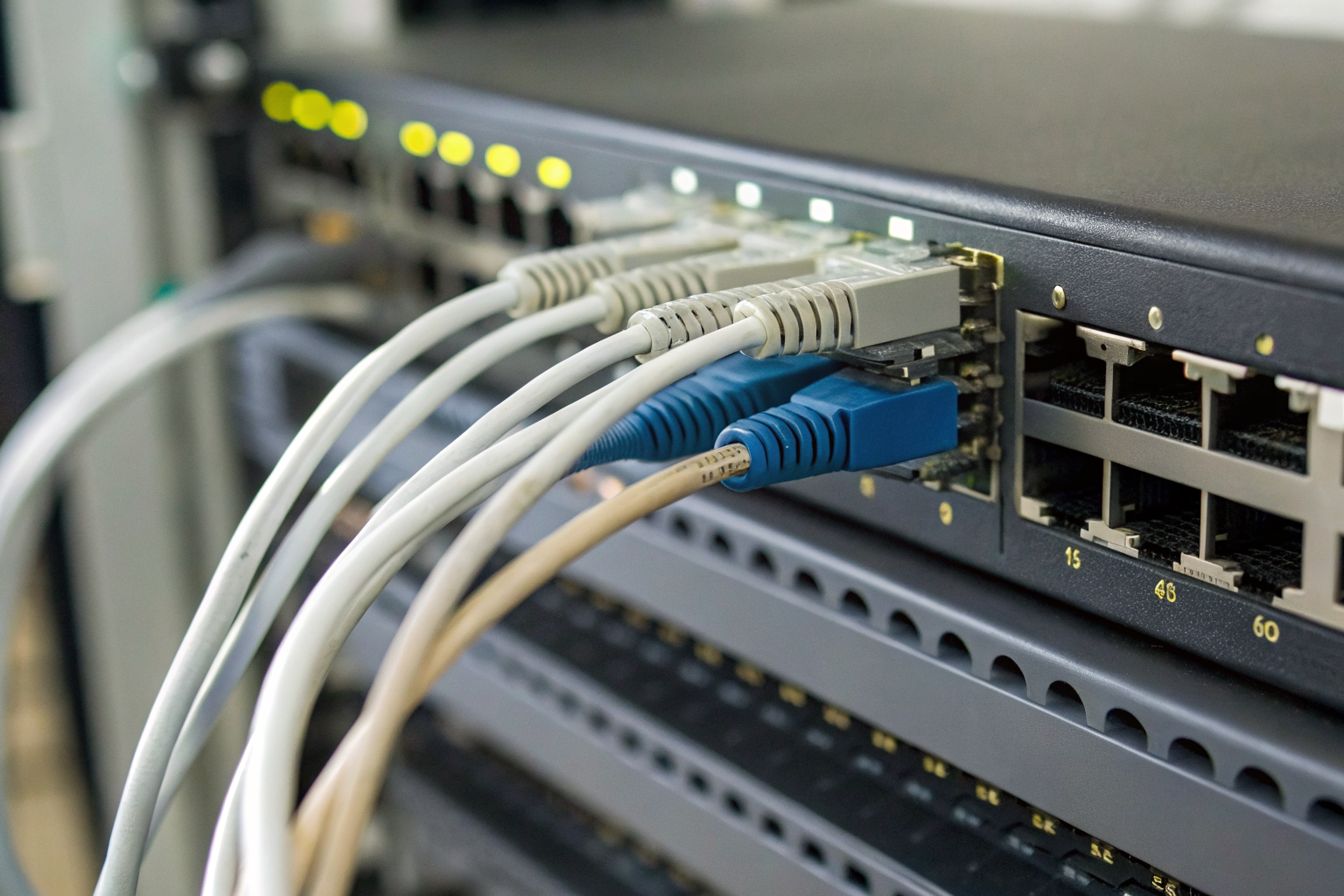 Close-up of network equipment memory chips under bright lighting.